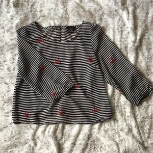Black, white and red blouse with cute buttons!